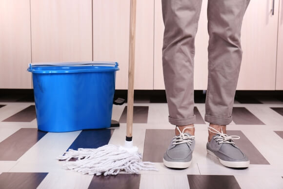 Mop, Feet, and Bucket ready to clean floors
